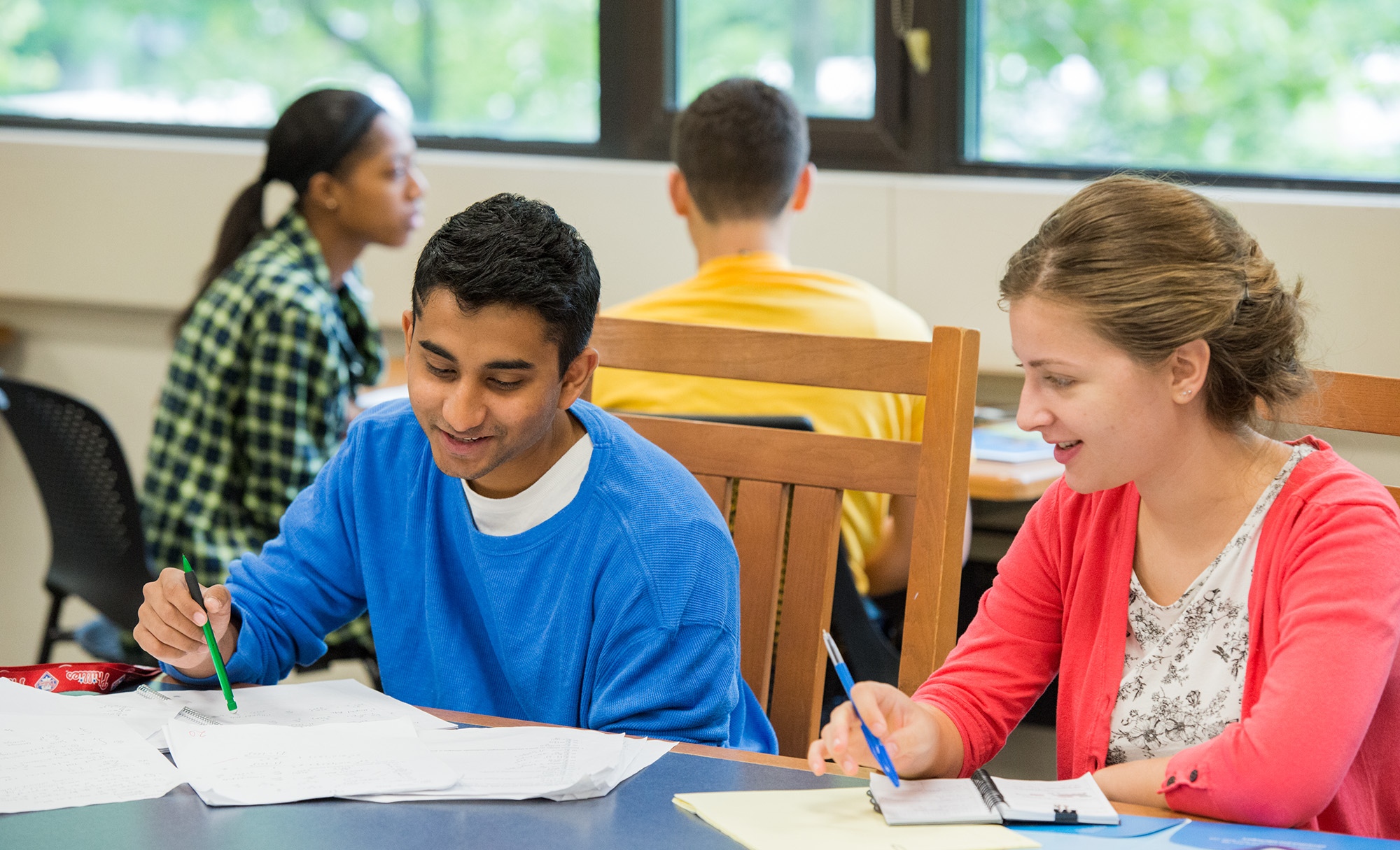 Two students working on a classroom assignment together during class